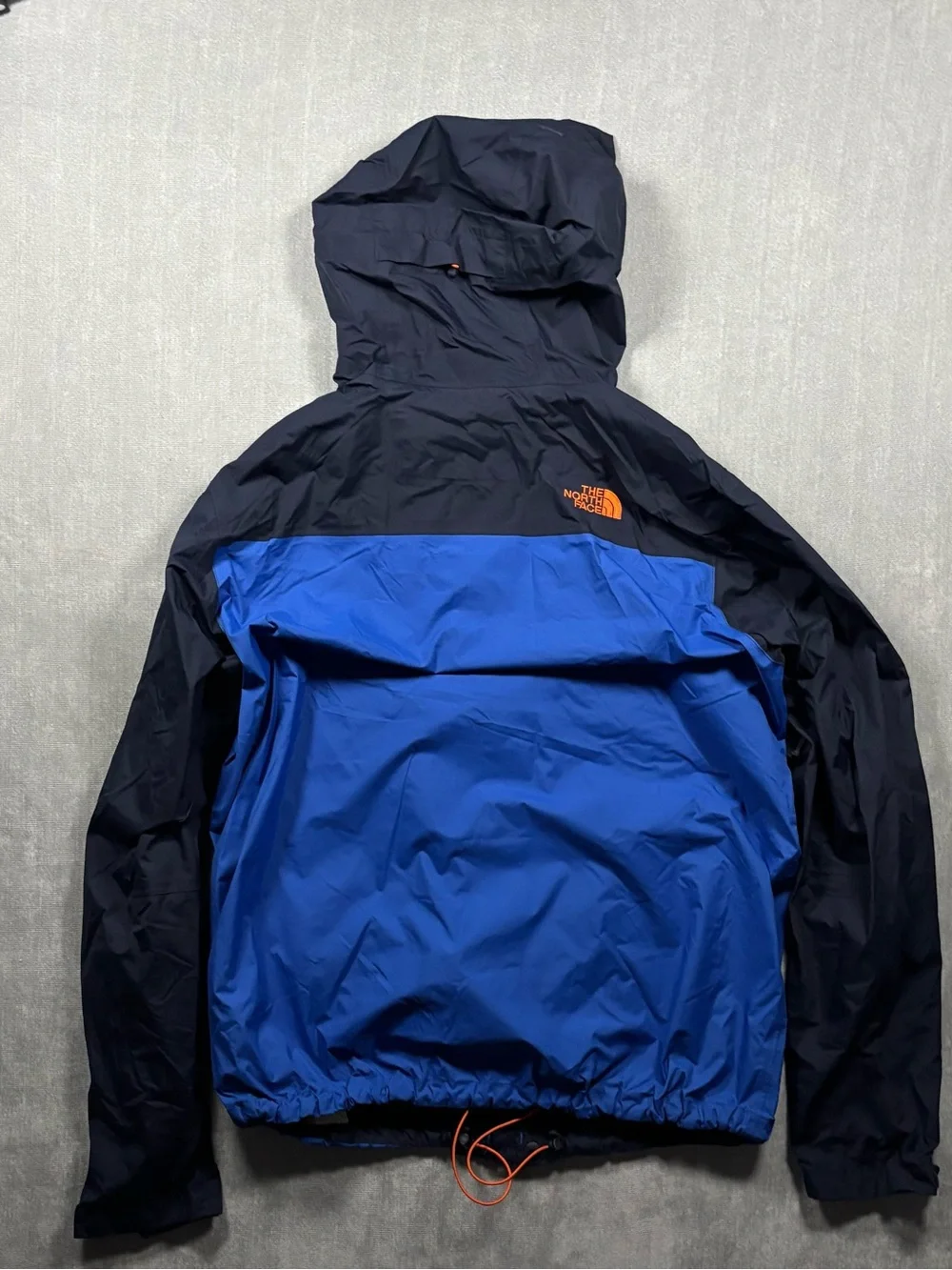 The North Face Navy & Royal Blue Hooded Rain Shell with Orange Accents